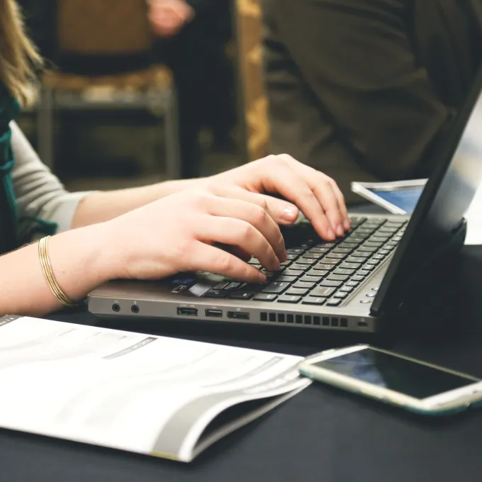"stock image typing on laptop"